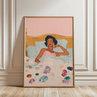artwork of a woman in bed with colorful gemstones on a light-colored wall.