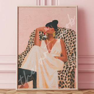 Art print of a Black woman in a flowing white gown and gold jewelry, seated in a leopard print armchair against a soft pink background.